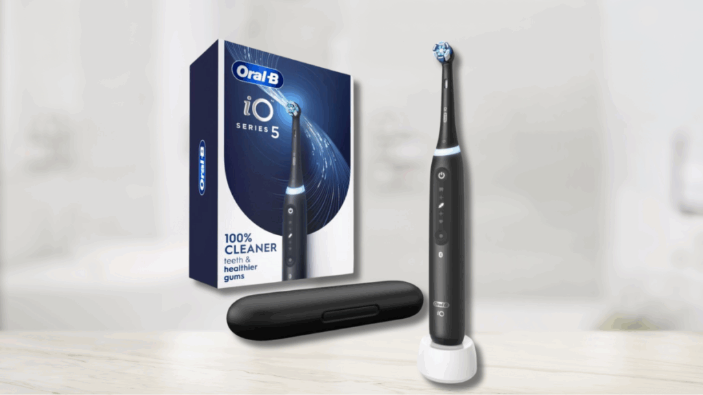 Oral-B iO Series 5 electric toothbrush with smart features, charging stand, case, and branded packaging.